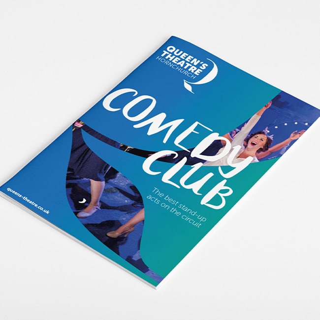 Promotional leaflet for Queen’s Theatre Hornchurch’s Comedy Club, featuring bold hand-drawn white typography on a vibrant blue and teal background with joyful theatre photography integrated into abstract cut-out shapes.