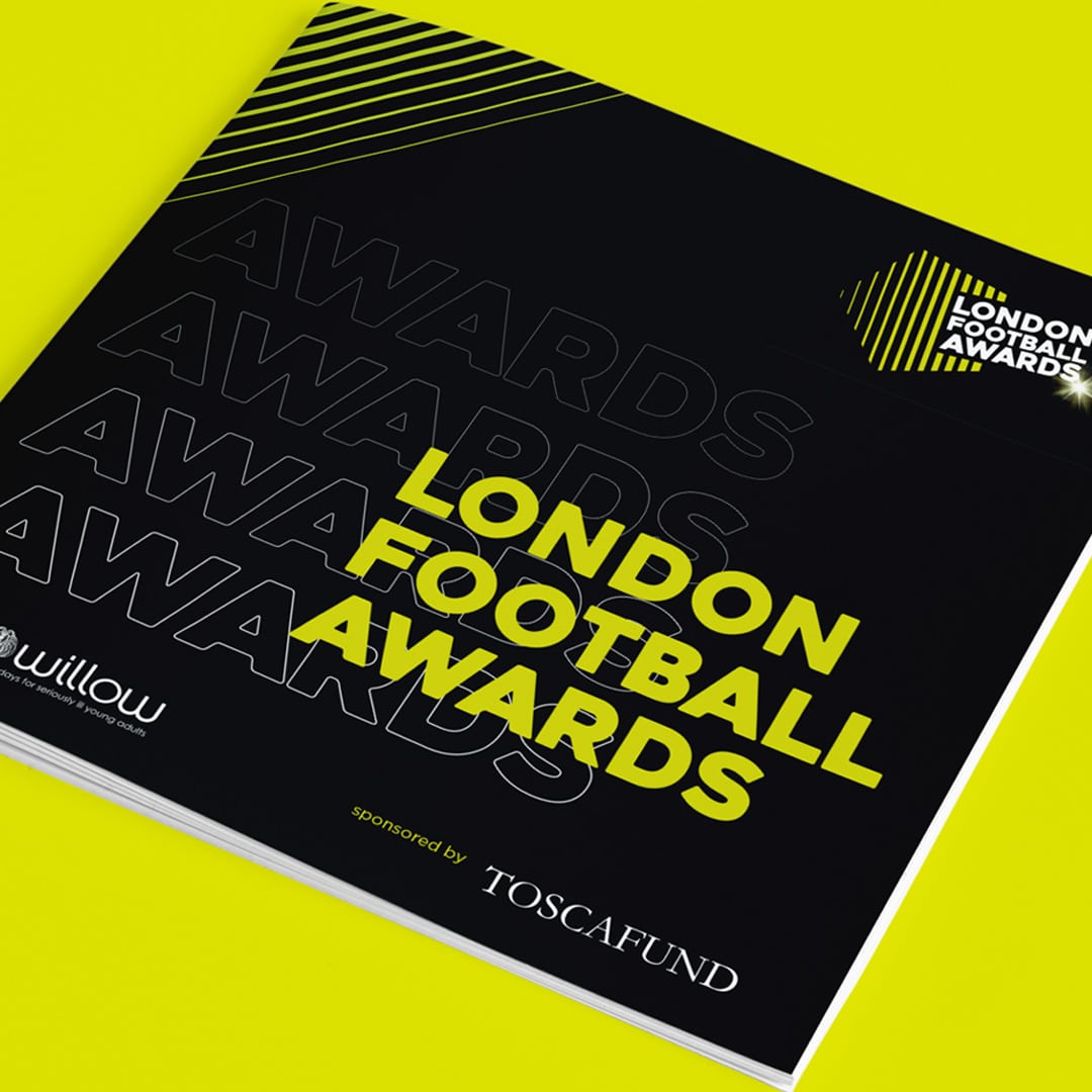 Cover of the London Football Awards 2020 programme with bold yellow typography on a black background and dynamic linear graphics, designed to reflect the energy of the event.