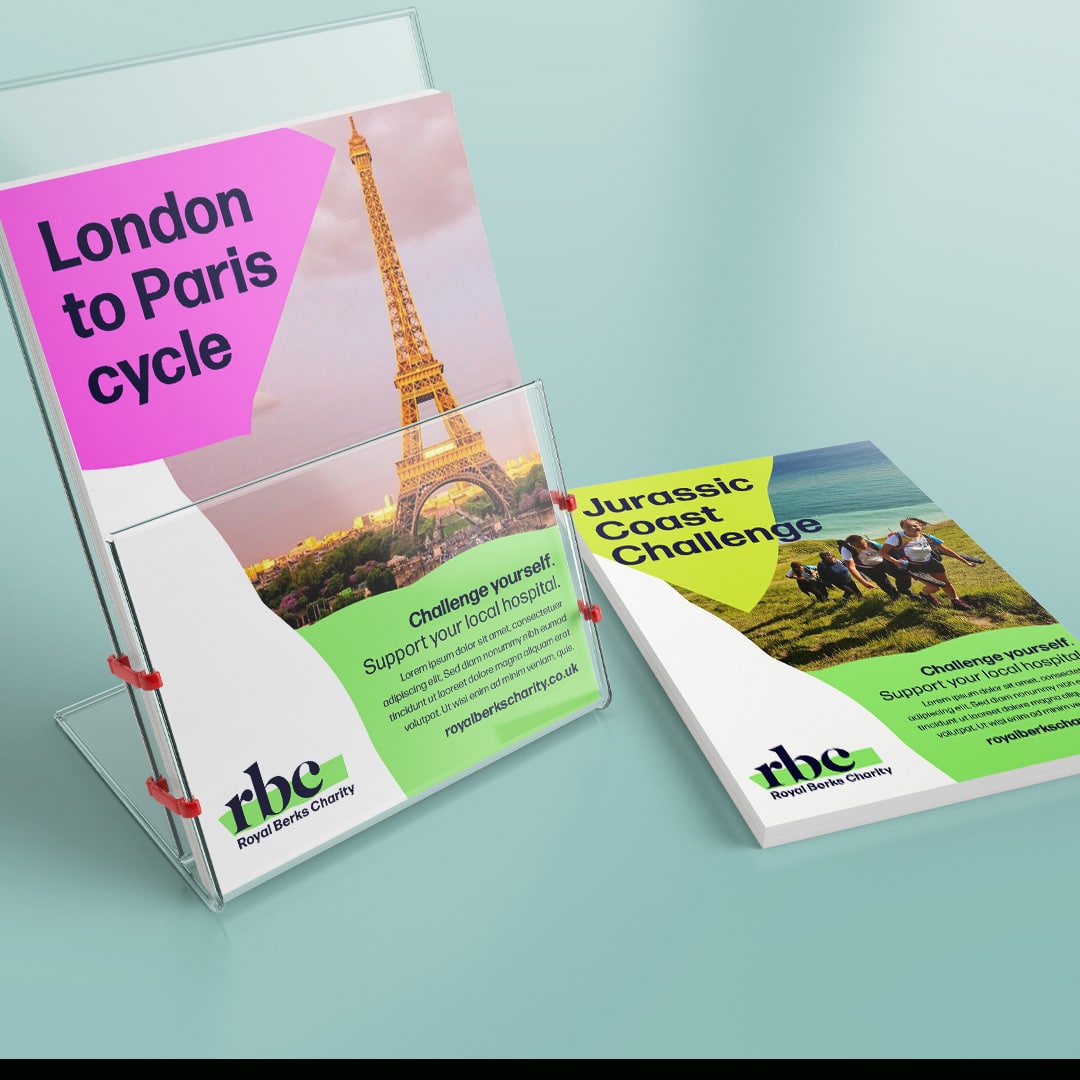 Fundraising materials for Royal Berks Charity showing leaflets promoting the ‘London to Paris cycle’ and ‘Jurassic Coast Challenge’, with bright green and pink accents and bold typography.