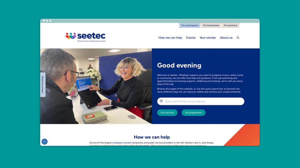 • Website homepage for Seetec displaying a woman assisting a man at a laptop, with a welcoming message and service navigation options.