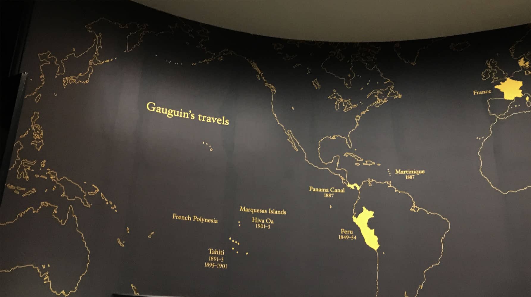 Illustrated wall map showing Gauguin’s travels across the globe, with highlighted locations and dates including Peru, Martinique, Panama Canal, Tahiti, and France.