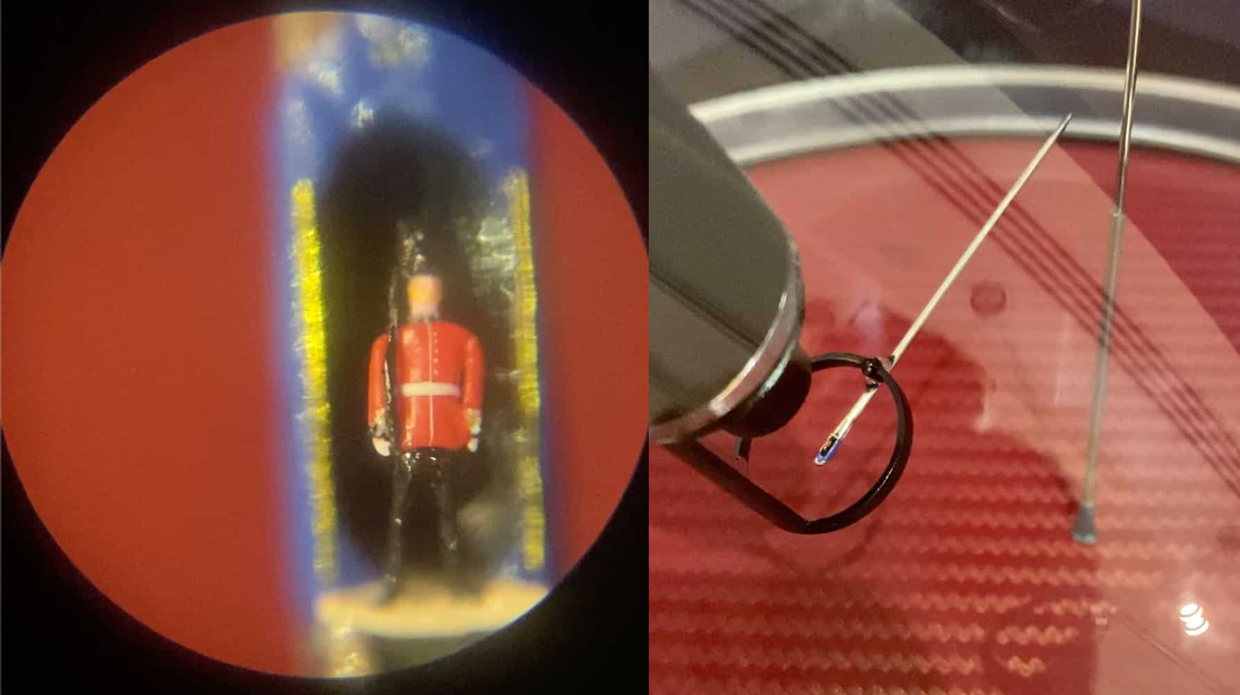 Close-up of a miniature royal guard sculpture viewed through a microscope.