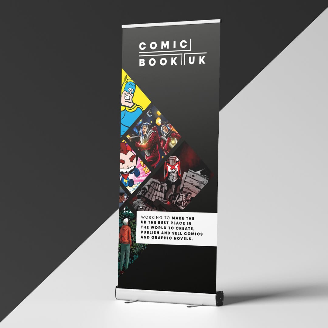 Freestanding Comic Book UK promotional banner displaying the brand logo and mission alongside a grid of colourful comic character panels.